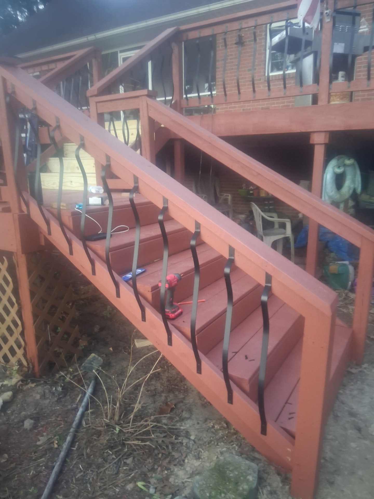 Rebuilt deck stairs with iron balusters